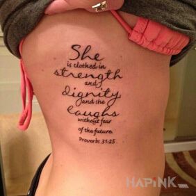 Tattoo Clad in strength on the ribs motif: lettering