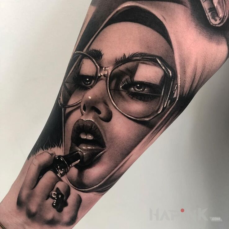 Tattoo Arcymistrzowski portret in faces motif and realistic style on the forearm