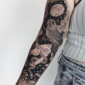 Tattoo Owl on the forearm motif: black and gray style: graphic / illustrative