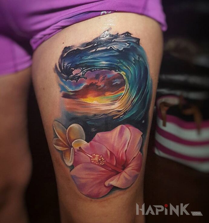 Tattoo Fala i kwiat in flowers motif on the leg