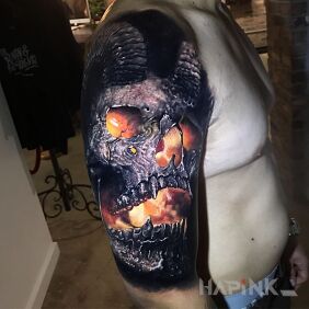 Tattoo Powerful skull on the upper arm motif: 3D style: realistic