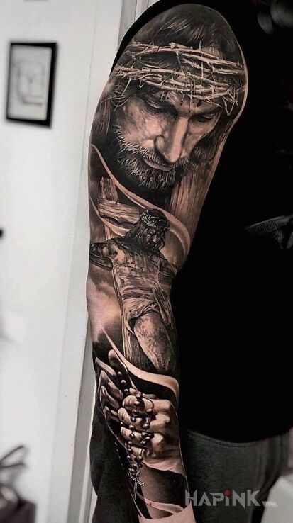 Tattoo Jezus Chrystus in black and gray motif on the upper arm