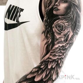 Tattoo Wing on the upper arm motif: black and gray style: realistic