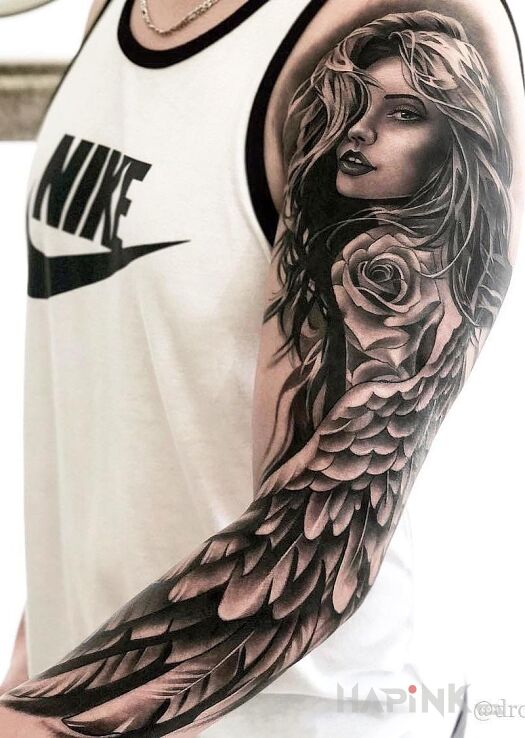 Tattoo Skrzydełko in sleeves motif and realistic style on the upper arm