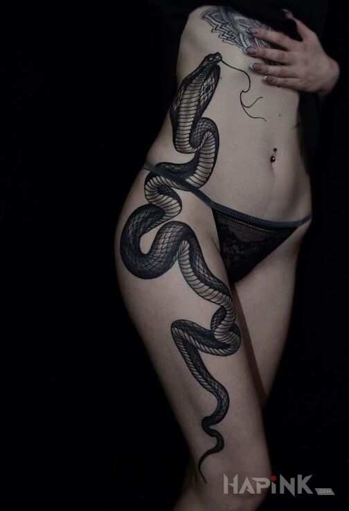 Tattoo Kobra in animals motif and realistic style on the leg