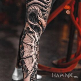 Tattoo Demonic leg on the leg motif: wings style: organic