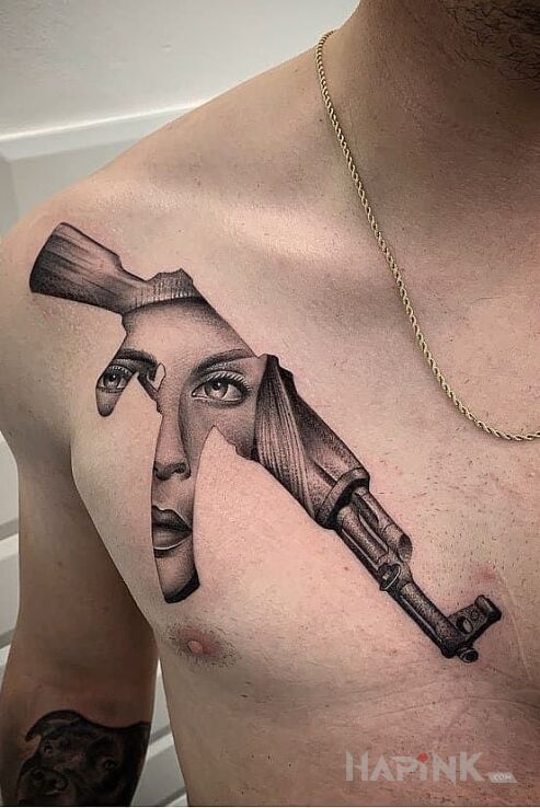 Tattoo Twarz w karabinie in objects motif and dotwork style on the chest