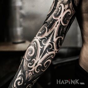 Tattoo Interesting design on the forearm motif: black and gray style: graphic / illustrative