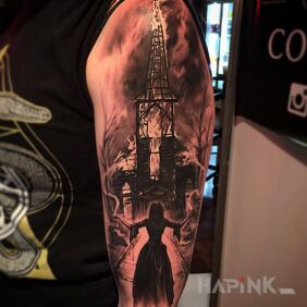 Tattoo Burning church on the upper arm motif: characters