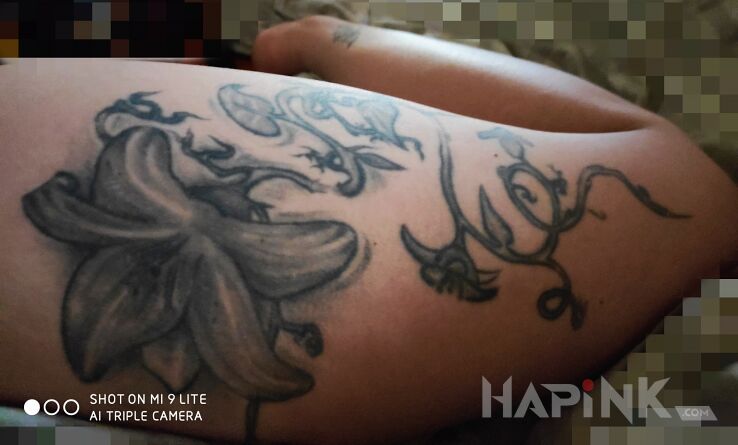 Tattoo Lilia in flowers motif and graphic / illustrative style on the leg