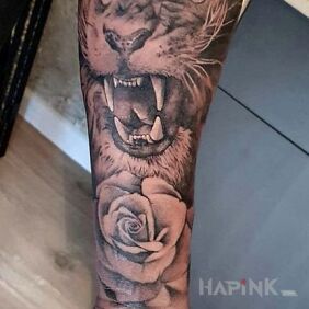 Tattoo Annoyed lion on the forearm motif: 3D style: realistic