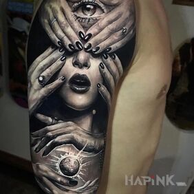 Tattoo Blinded on the upper arm motif: black and gray style: realistic