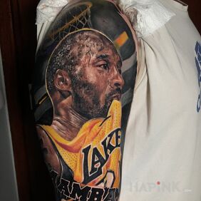 Tattoo Kobe on the upper arm motif: faces style: realistic