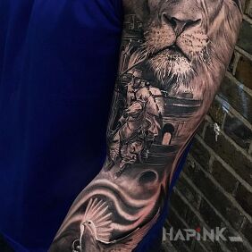 Tattoo Lion on the upper arm motif: animals style: realistic