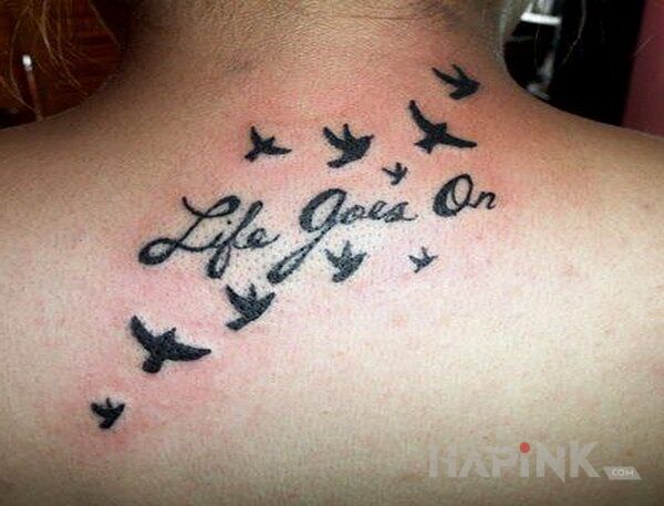 Tattoo Life goes on in lettering motif on the back
