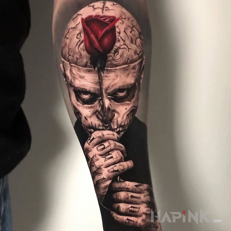 Tattoo Zombie Boy in black and gray motif and realistic style on the forearm