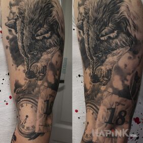 Tattoo Wolf on the upper arm motif: animals style: realistic
