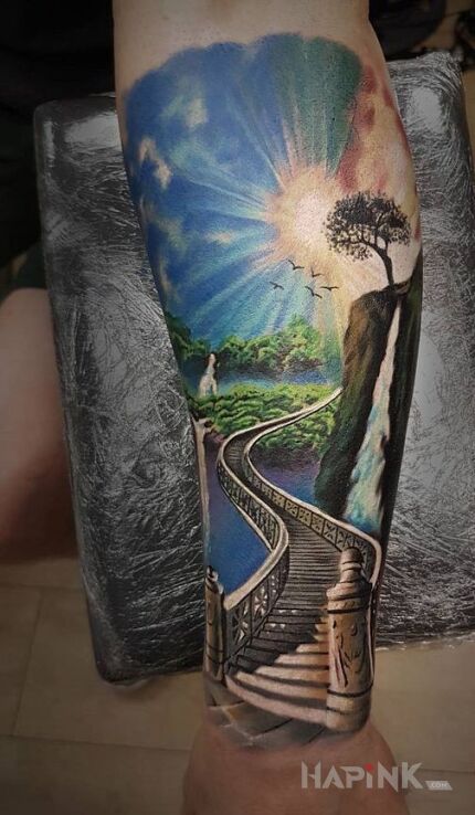 Tattoo Droga do raju in realistic style on the forearm