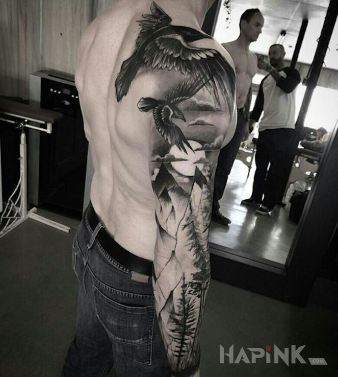 Tattoo Dwa ptaki na niebie in black and gray motif and graphic / illustrative style on the upper arm