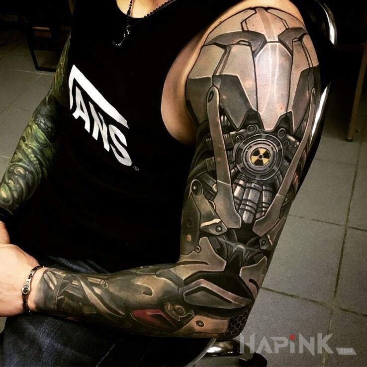 Tattoo Biomechaniczna ręka in black and gray motif and realistic style on the upper arm