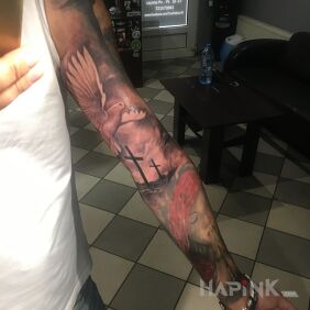 Tattoo Golgotha on the forearm motif: religious style: realistic