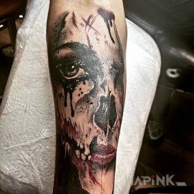 Tattoo Horror tattoo on the forearm motif: faces style: realistic