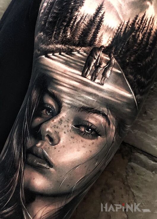Tattoo Spacer in faces motif and realistic style on the upper arm