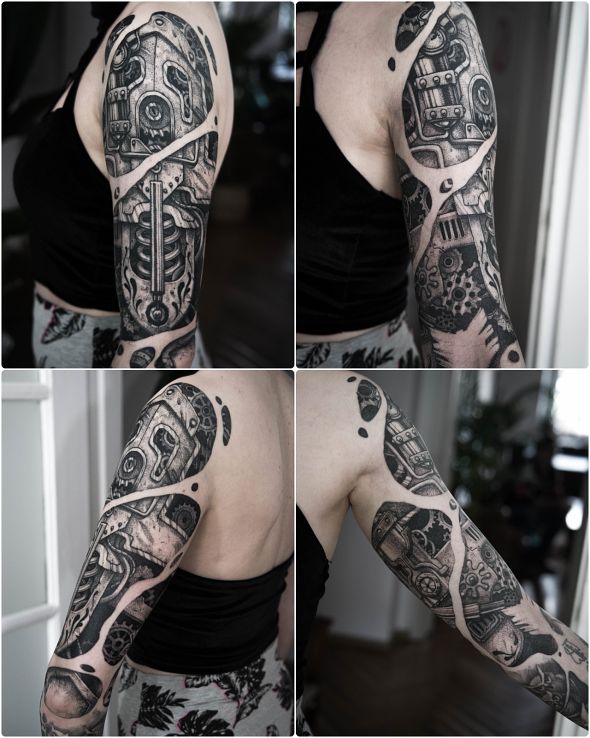 Tatuaż steampunk w motywie steampunk i stylu biomechanika na ramieniu