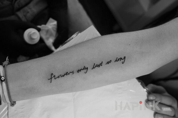Tattoo Jeszcze jeden napis in lettering motif on the forearm
