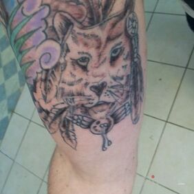 Tattoo Linden terrible on the upper arm motif: characters