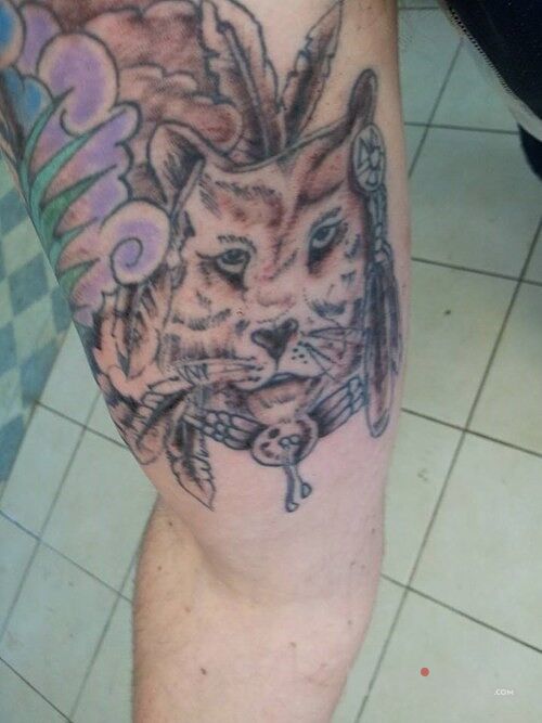 Tattoo Lipa straszna in characters motif on the upper arm