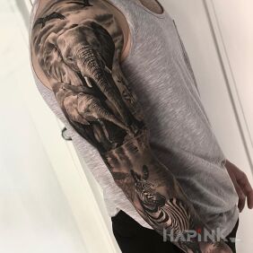 Tattoo Safari on the upper arm motif: sleeves style: realistic