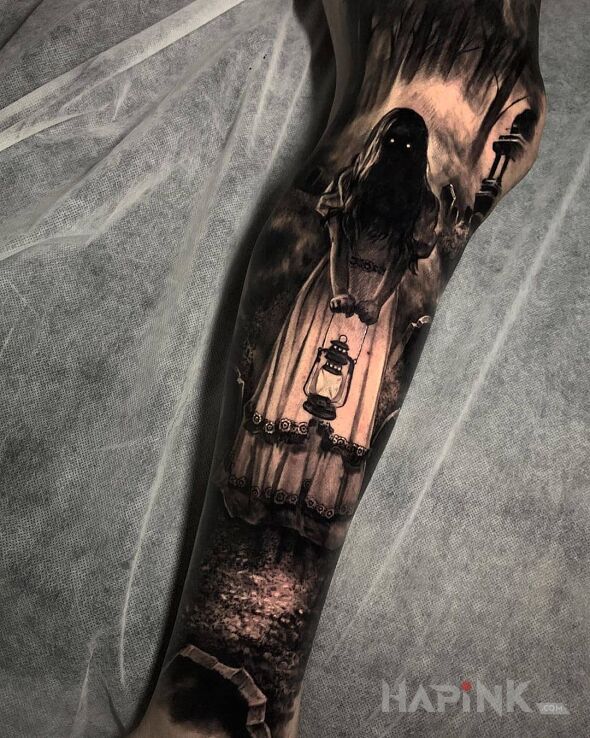 Tattoo Straszna dziewczynka in characters motif and realistic style on the calf