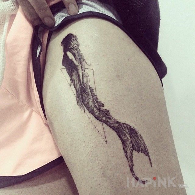 Tattoo Syrena in black and gray motif and graphic / illustrative style on the leg