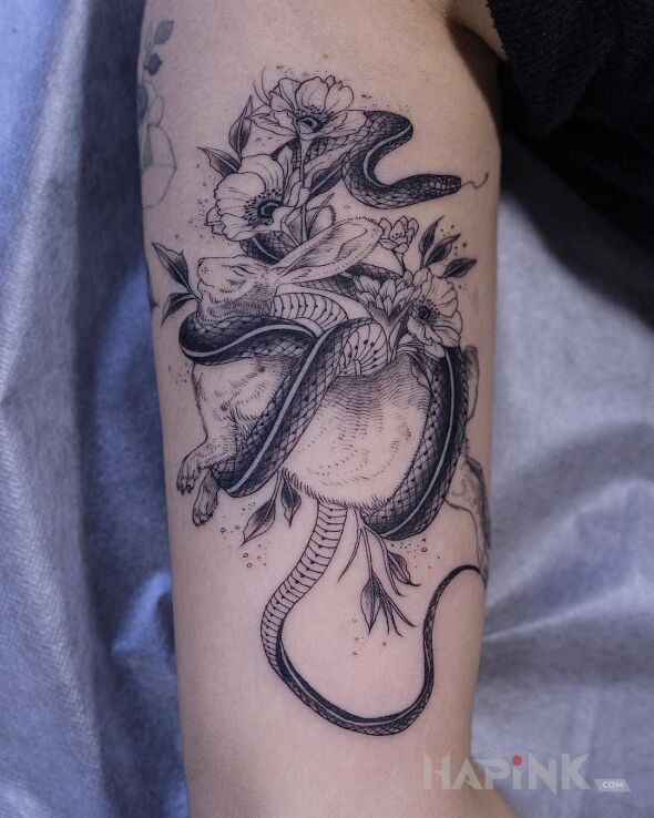 Tattoo Króliczek :( in black and gray motif and graphic / illustrative style on the upper arm