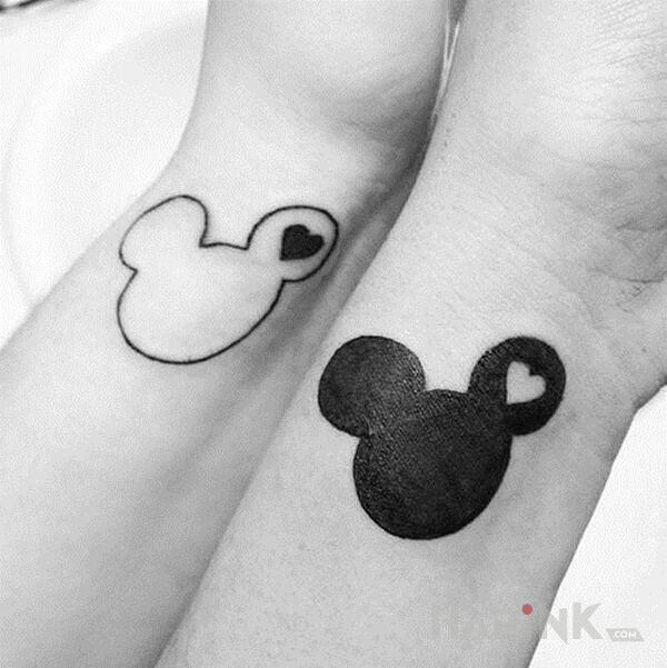 Tattoo Mickey mouse in Love motif and minimalistic style on the wrist
