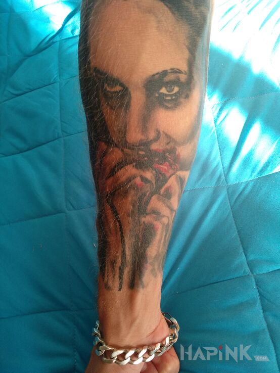 Tattoo Kobieta in characters motif on the forearm
