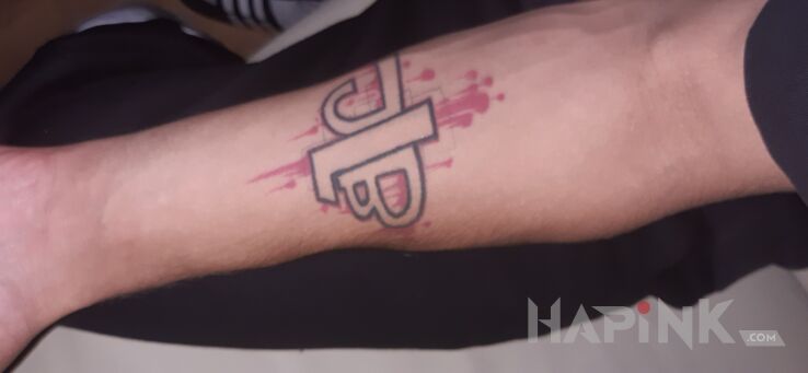 Tattoo JLB in lettering motif and graffiti style on the forearm