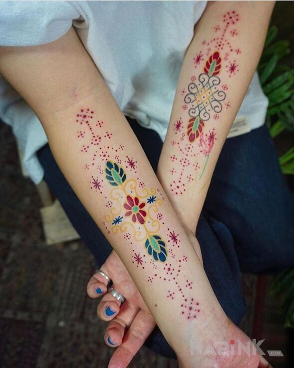 Tattoo Kolorowe wzory in colorful motif on the forearm