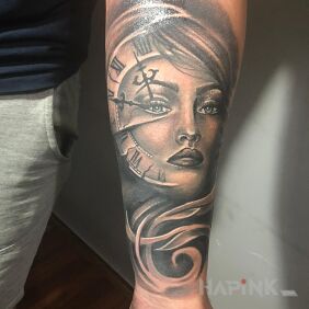 Tattoo The face of a woman with a clock on the forearm motif: faces style: realistic