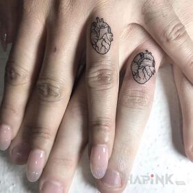 Tattoo Hearts two on the fingers motif: anatomical style: minimalistic
