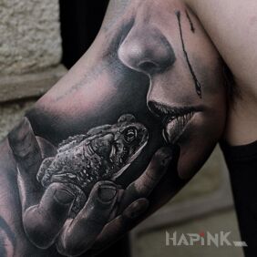 Tattoo Zaba on the upper arm motif: animals style: realistic