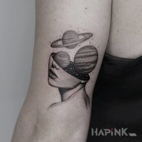 Tattoo Cosmos in the head on the upper arm motif: faces