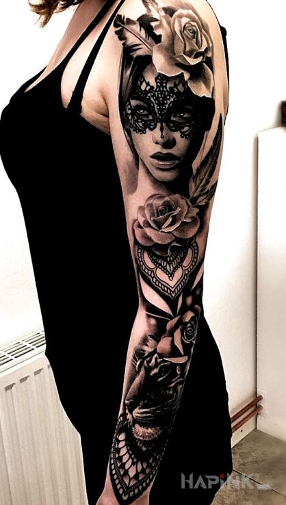Tattoo Kobieta w masce in black and gray motif and realistic style on the upper arm