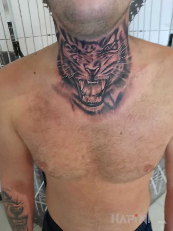 Tattoo Tiger in animals motif on the throat