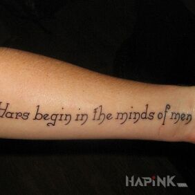 Tattoo Where does the war begin? on the forearm motif: lettering style: calligraphy