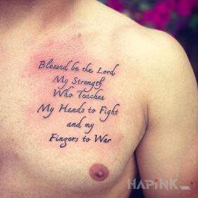 Tattoo Blessed be the Lord on the chest motif: lettering