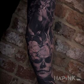 Tattoo Naked girl on the upper arm motif: black and gray style: realistic