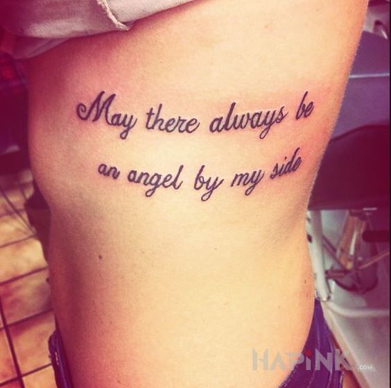 Tattoo Anioł Stróż in lettering motif on the ribs