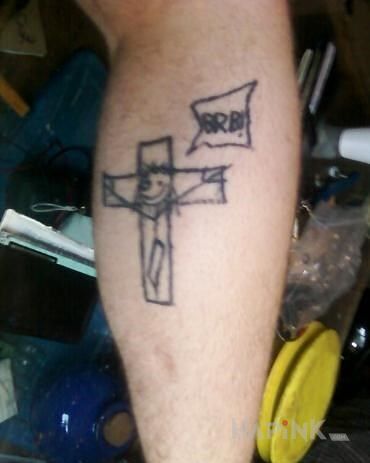 Tattoo Tragizm in other motif on the leg